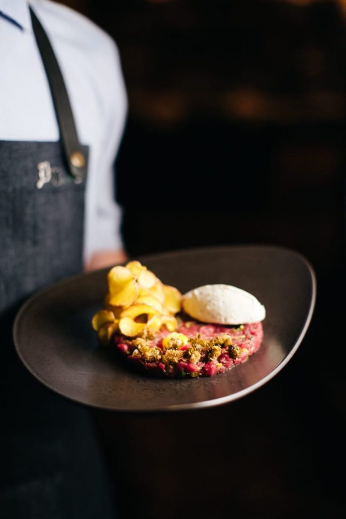 beef-tartare-with-raw-egg-yolk-popcorn-potatoe-c-2023-11-27-05-32-20-utc-768x1152
