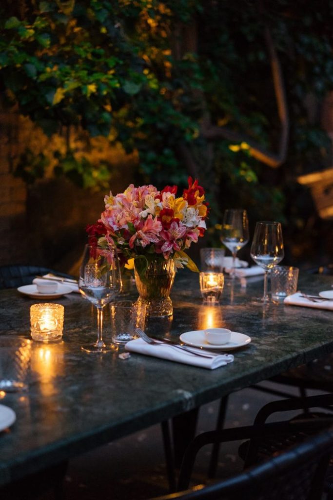 elegantly-set-table-at-beautiful-patio-2023-11-27-05-30-58-utc-705x1057